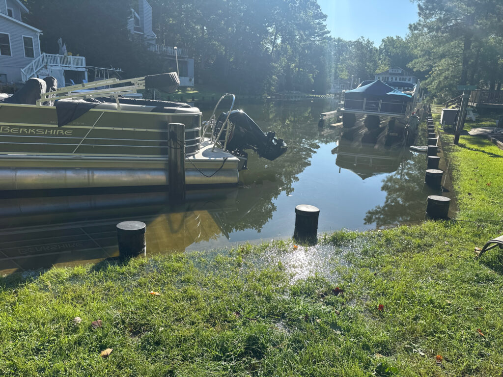 boats docked on a river (MyCoast AI)