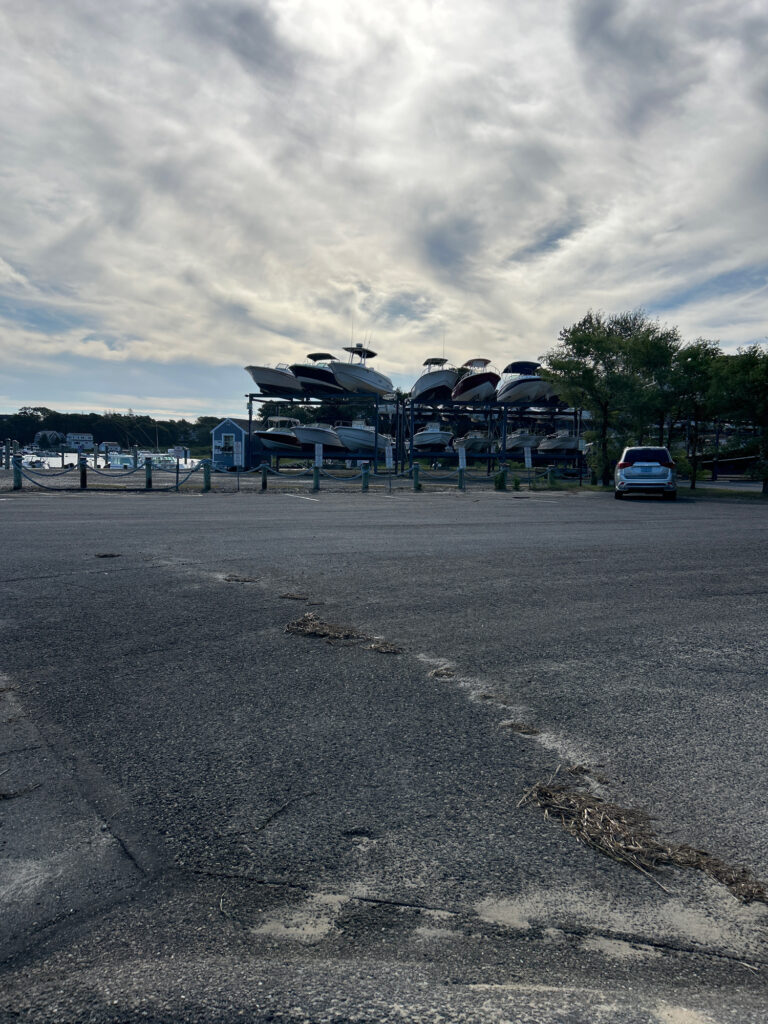 a parking lot with a building in the background (MyCoast AI)