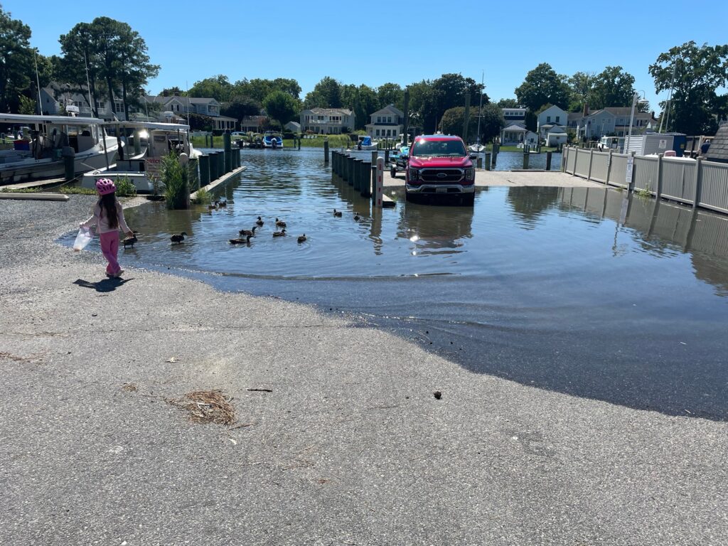 a girl standing in a flooded area (MyCoast AI)