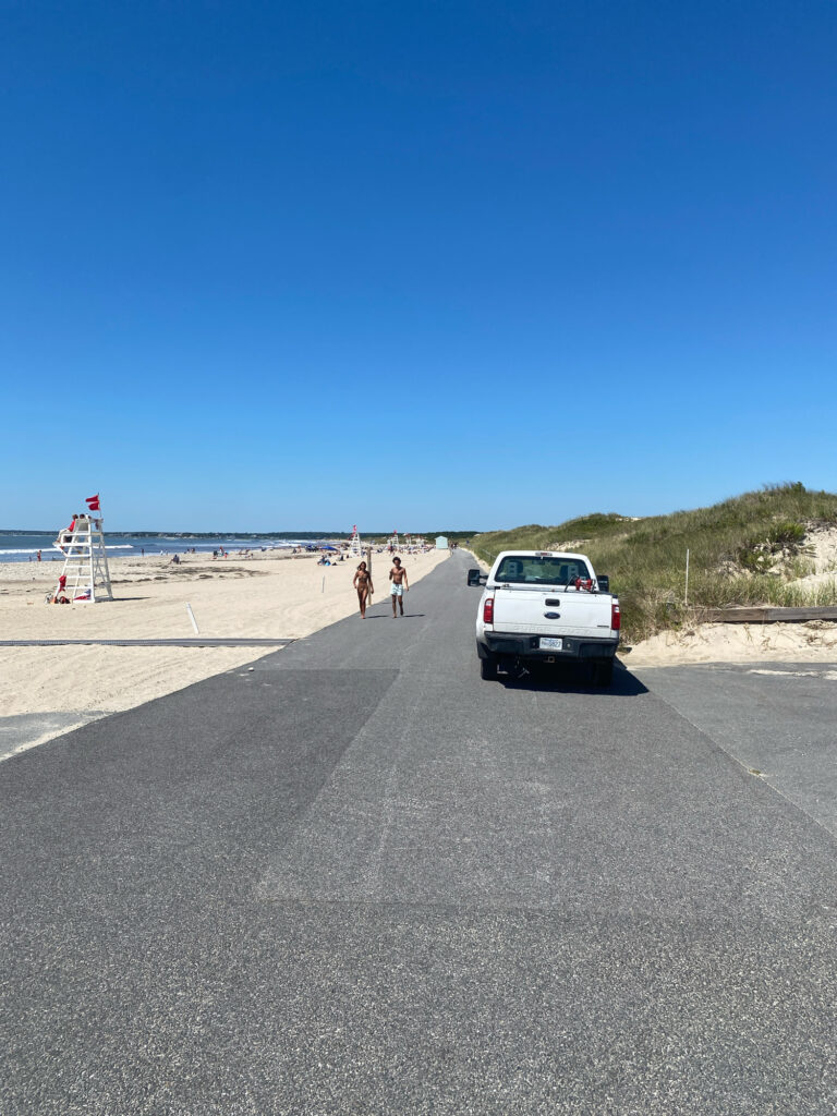 a car parked on a road next to a beach (MyCoast AI)