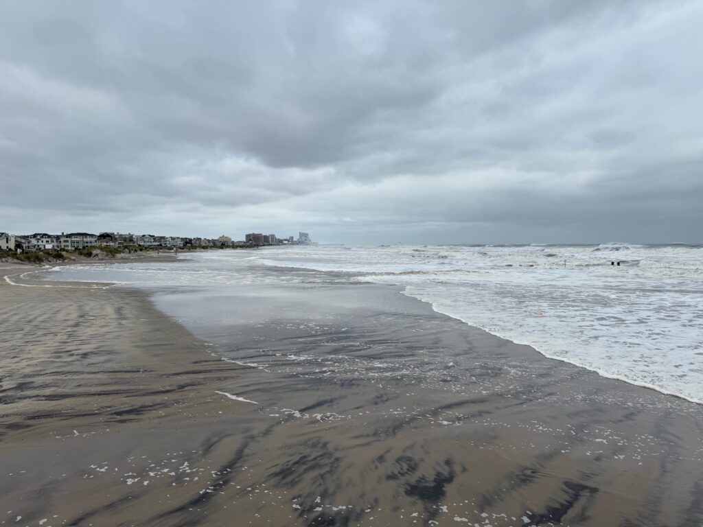 a beach with waves crashing on it (MyCoast AI)