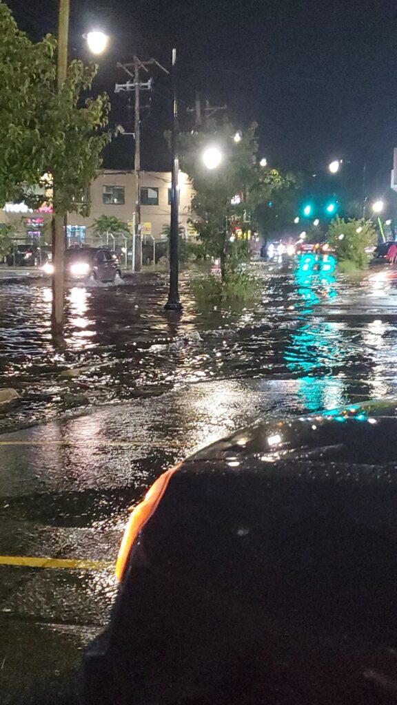 a car driving through a flooded street (MyCoast AI)