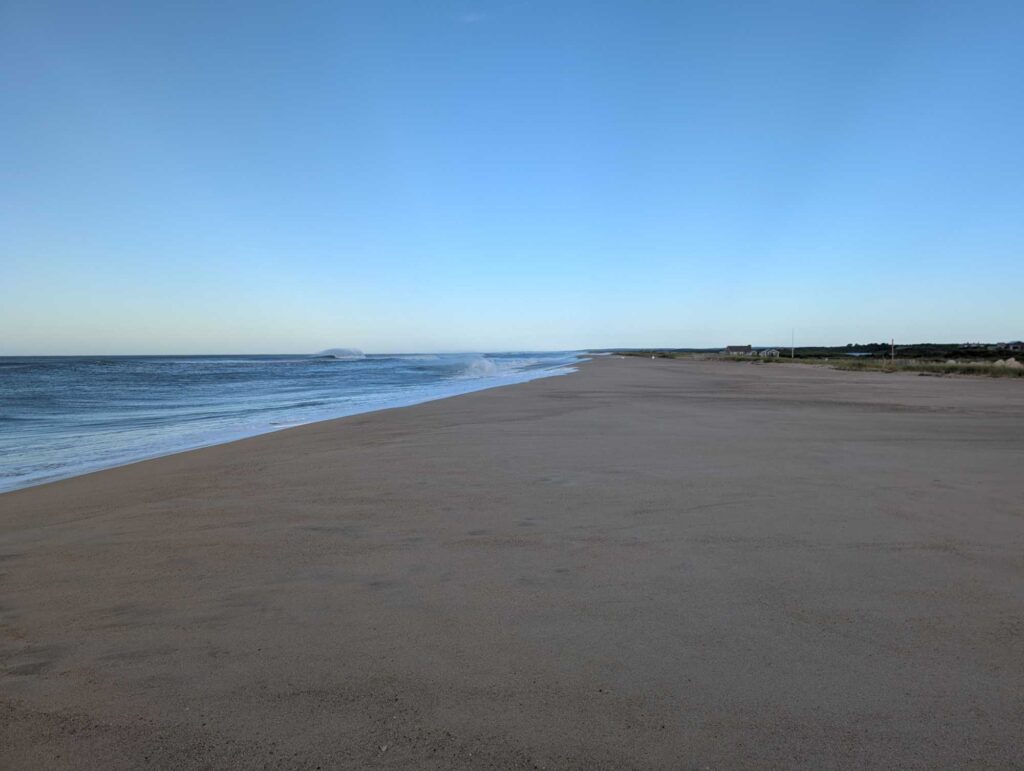 a sandy beach with blue sky (MyCoast AI)