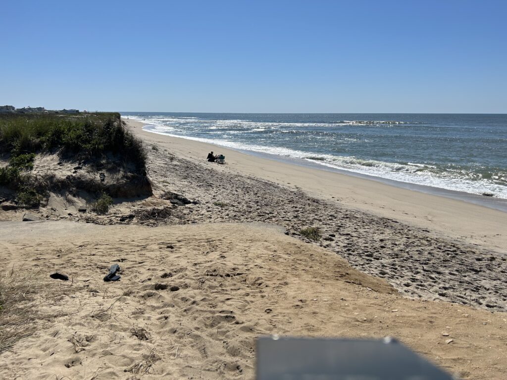 a beach with a laptop and a laptop on it (MyCoast AI)