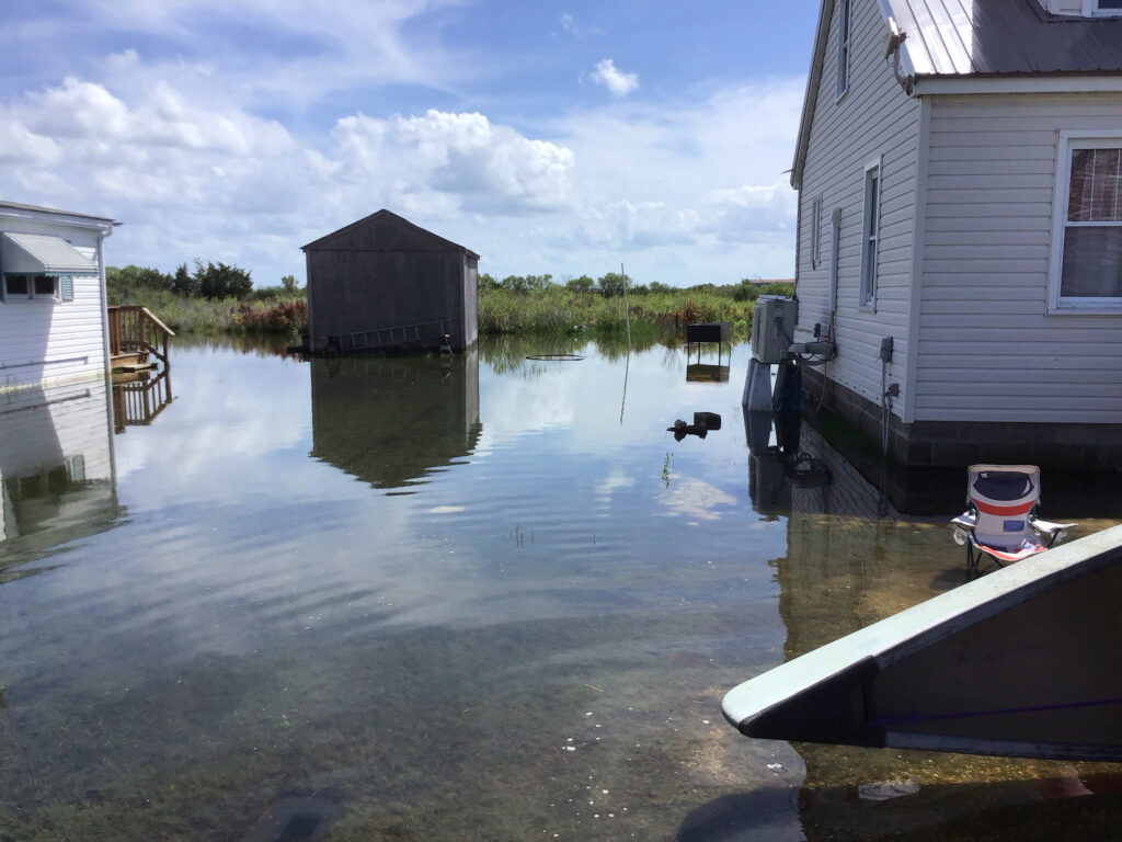 a body of water with buildings and a dock by it (MyCoast AI)