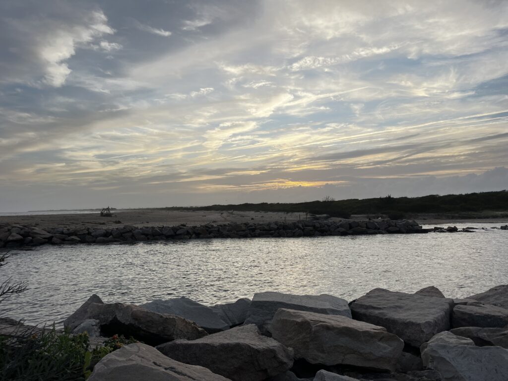 a rocky beach with a body of water in the background (MyCoast AI)