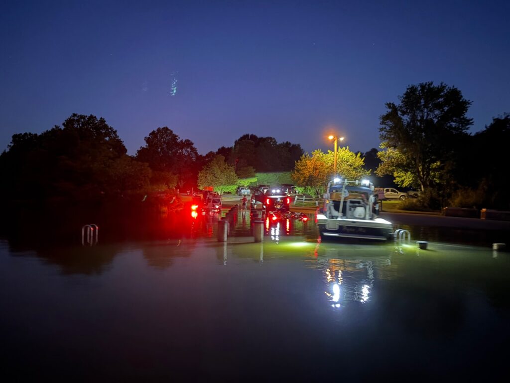 a group of fire trucks parked on the side of a river (MyCoast AI)