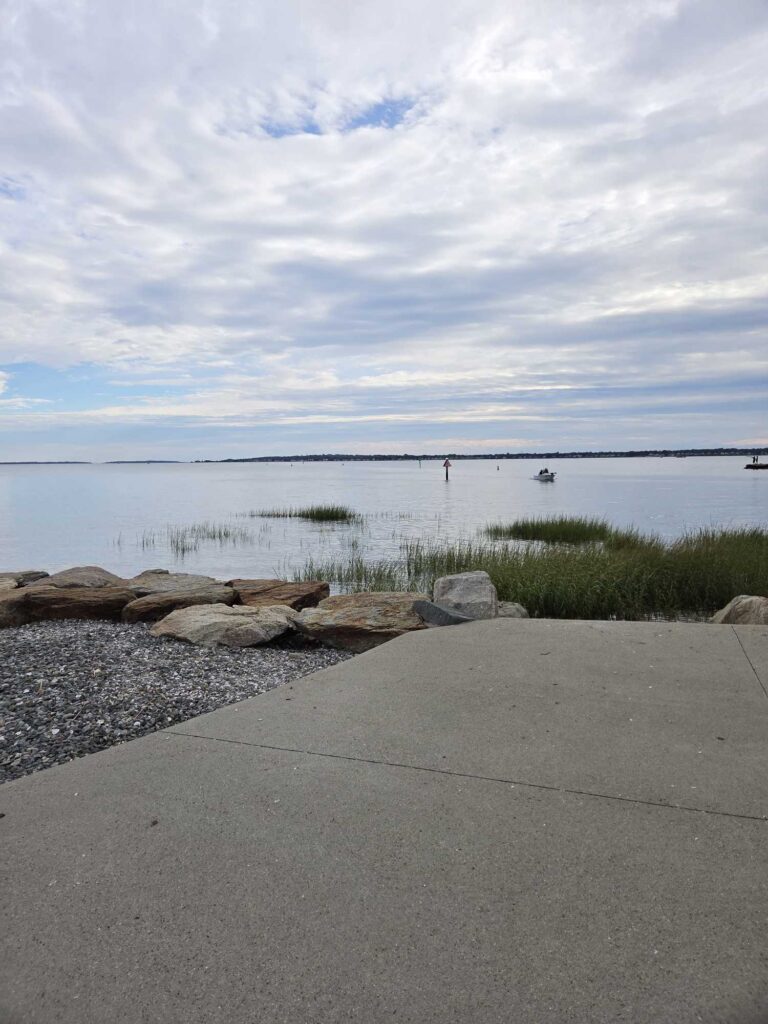 a road next to a body of water (MyCoast AI)