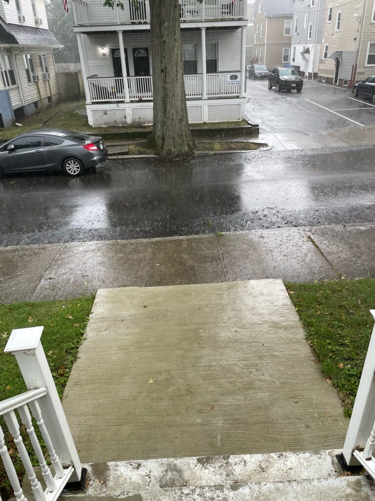 a puddle on the street (MyCoast AI)