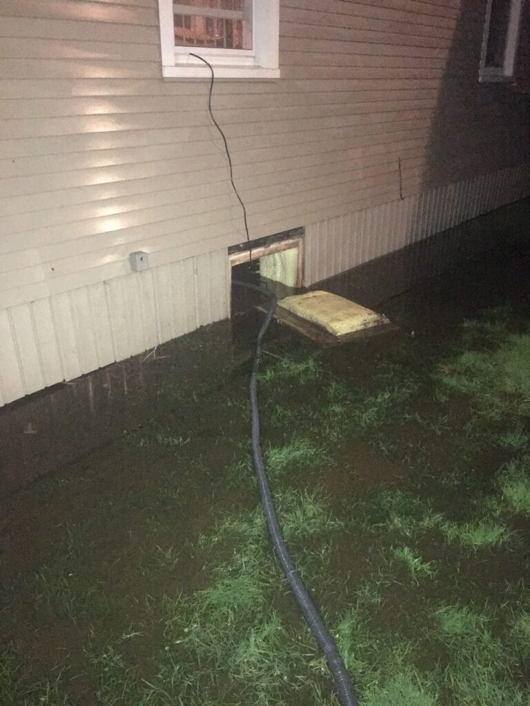 a hose on the grass (MyCoast AI)