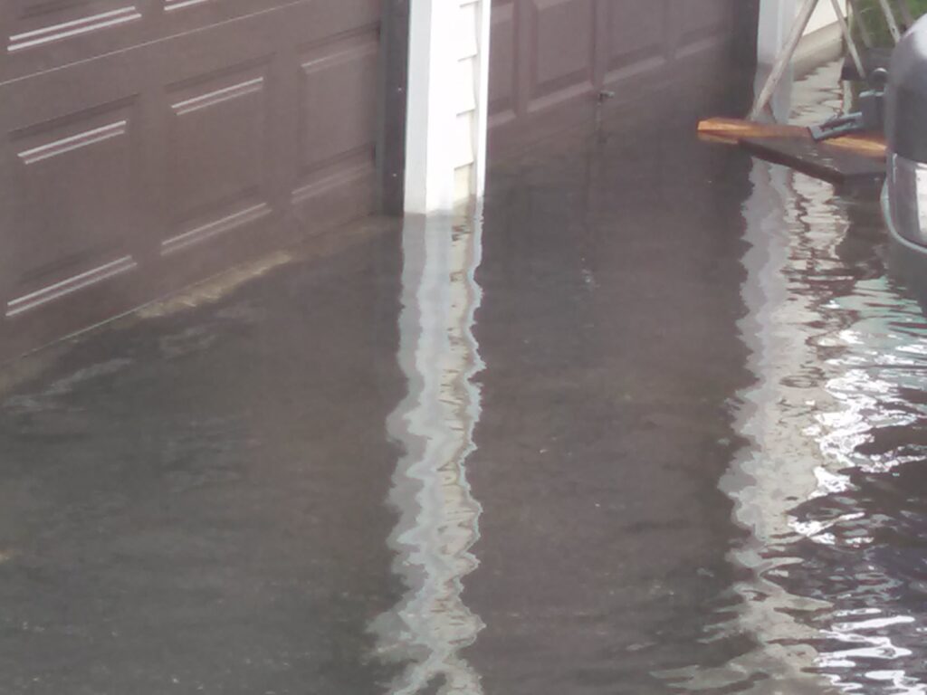 a puddle of water on the ground (MyCoast AI)