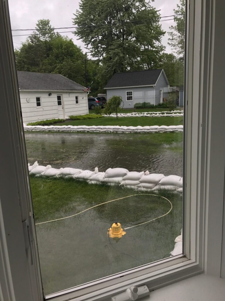 a house with a pond and a rope in the front (MyCoast AI)