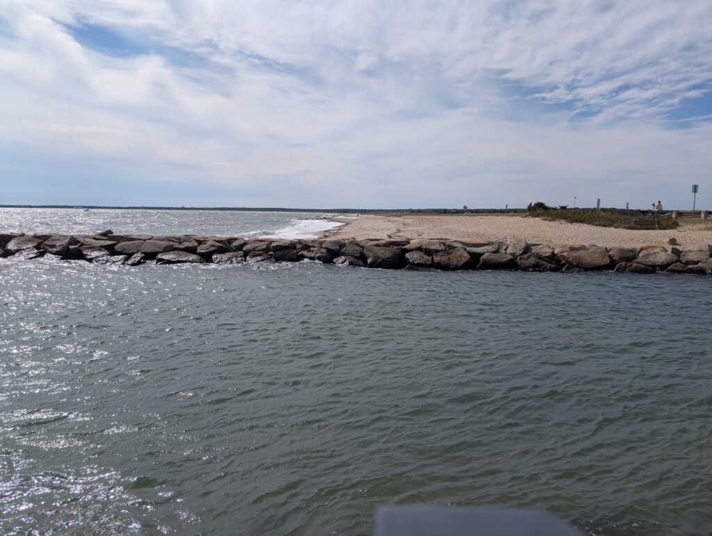 a rocky beach with a body of water in the background (MyCoast AI)
