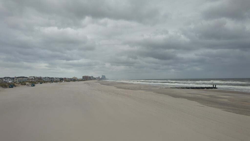 a beach with waves crashing on it (MyCoast AI)