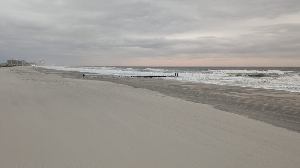 a beach with waves crashing on it (MyCoast AI)