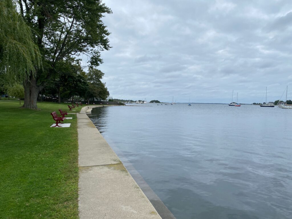 a bench sits by a body of water (MyCoast AI)