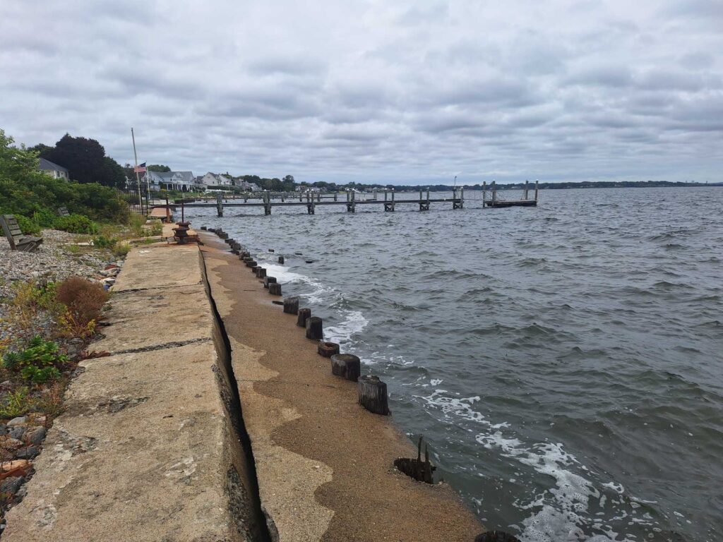 a path next to a body of water with a dock and a walkway (MyCoast AI)