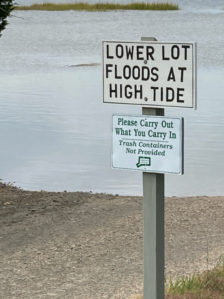a sign on a beach (MyCoast AI)