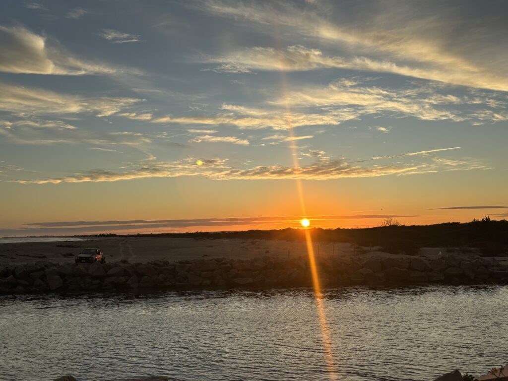 a sunset over a body of water (MyCoast AI)