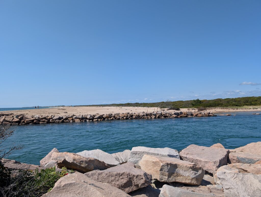 a body of water with rocks and land in the background (MyCoast AI)