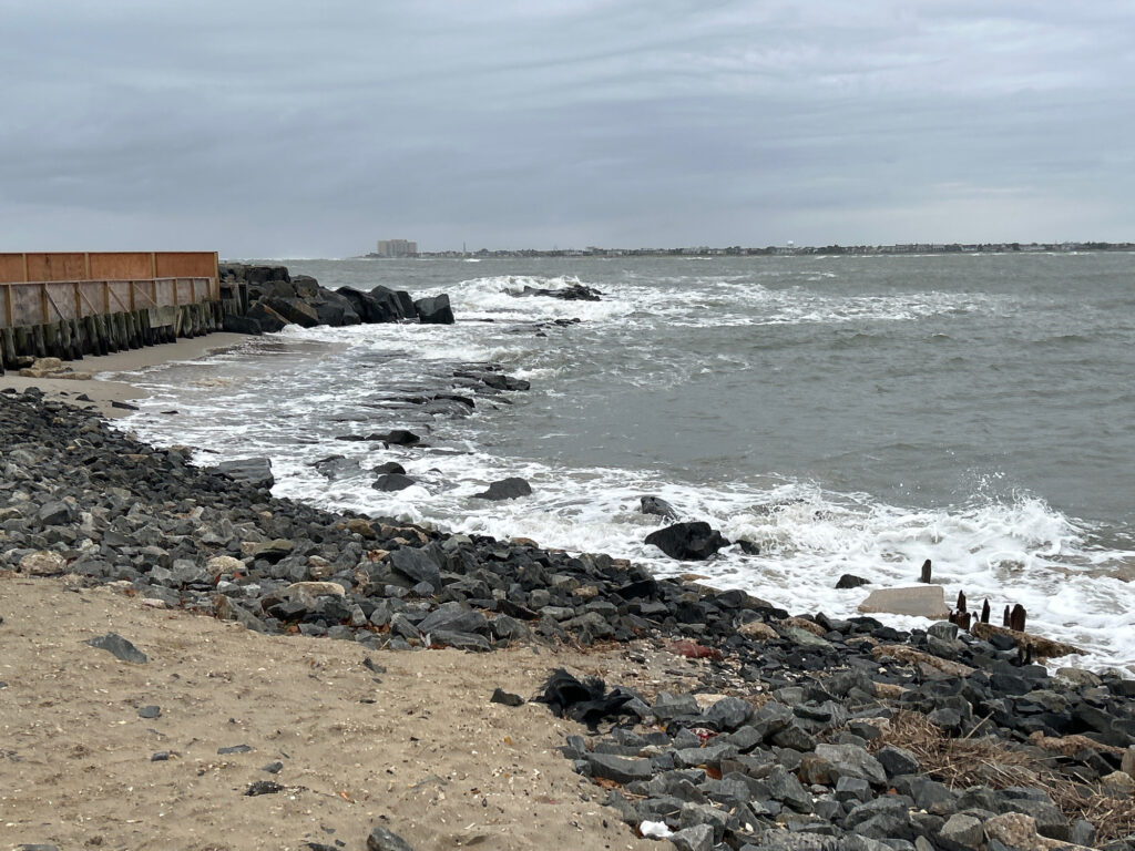 a rocky beach with waves crashing (MyCoast AI)