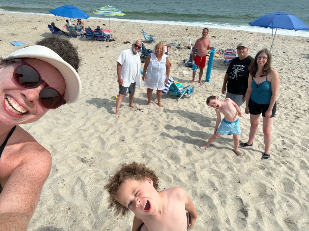 a group of people on a beach (MyCoast AI)