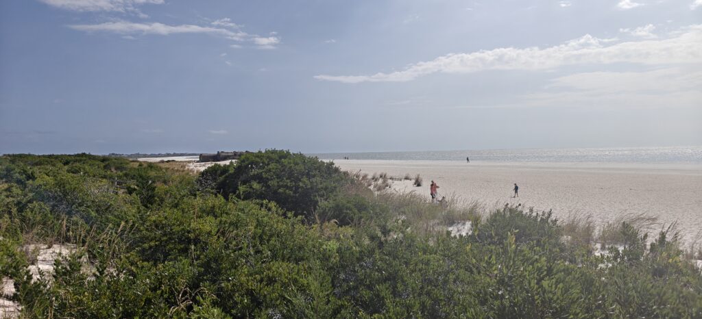 a group of people walking on a beach (MyCoast AI)