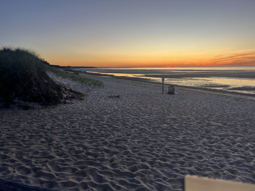 a sandy beach with a sunset (MyCoast AI)