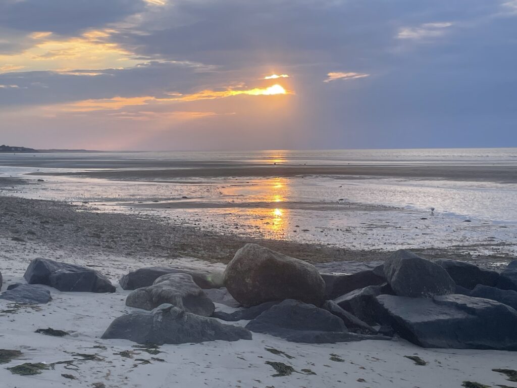 a beach with rocks and water (MyCoast AI)
