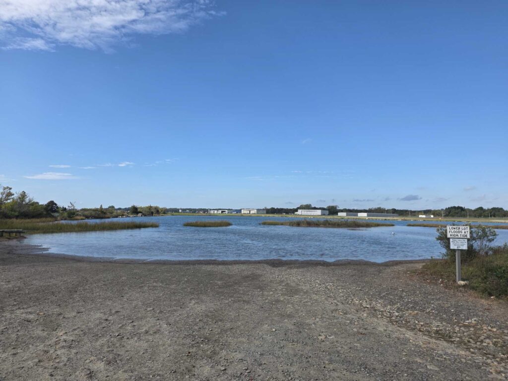 a body of water with a sign in the middle (MyCoast AI)