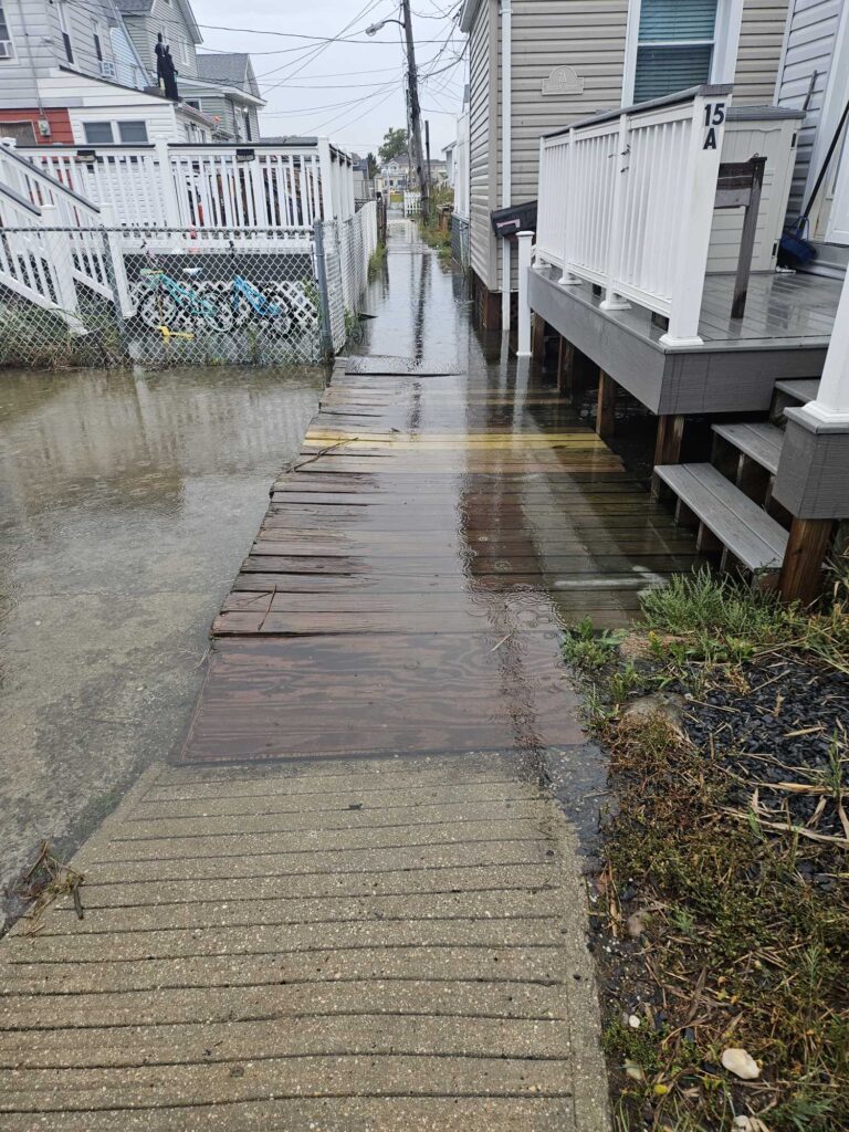 a wooden walkway between buildings (MyCoast AI)