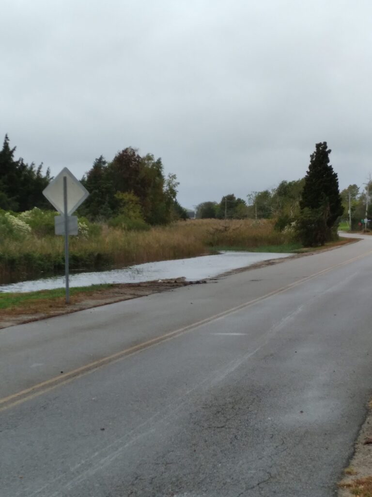 a road with a sign on it (MyCoast AI)