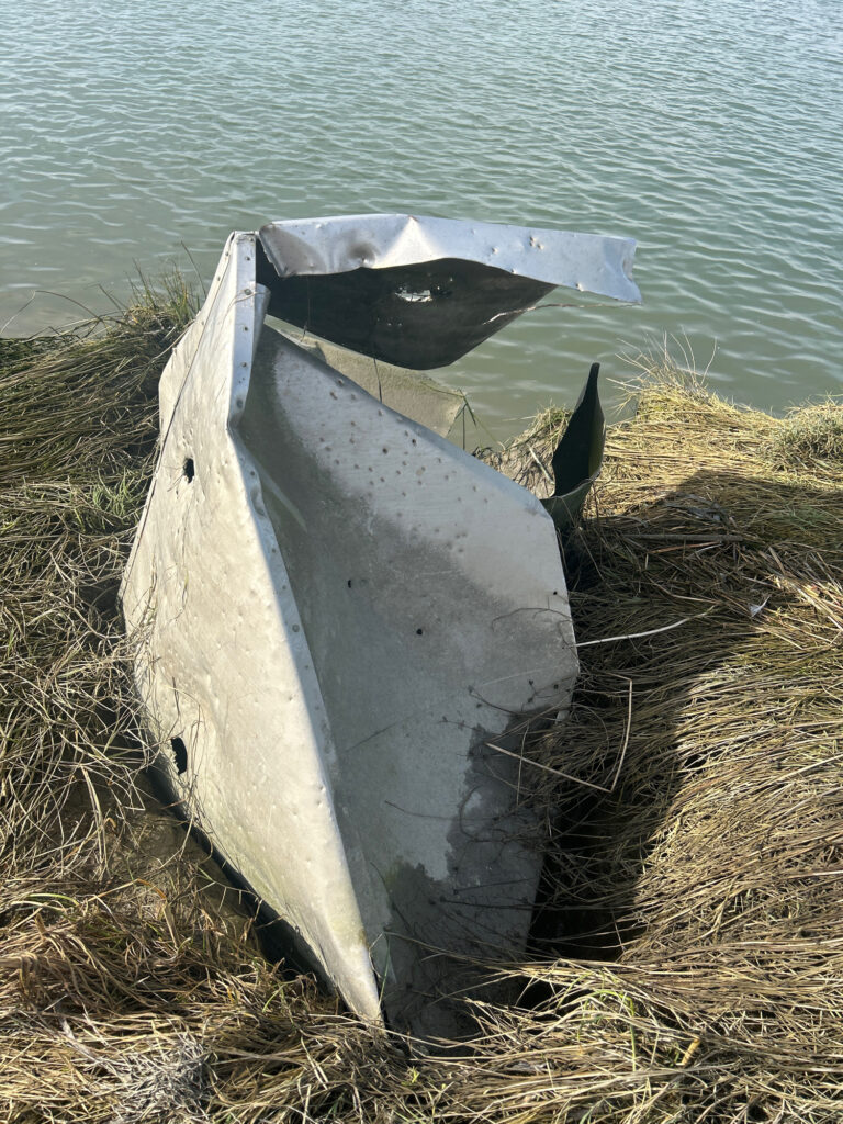 a white boat on the water (MyCoast AI)