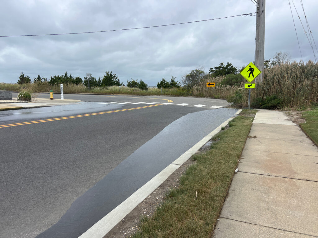 a road with a sign on it (MyCoast AI)