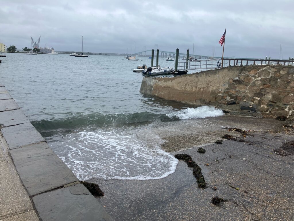 a rocky beach with boats in the water (MyCoast AI)