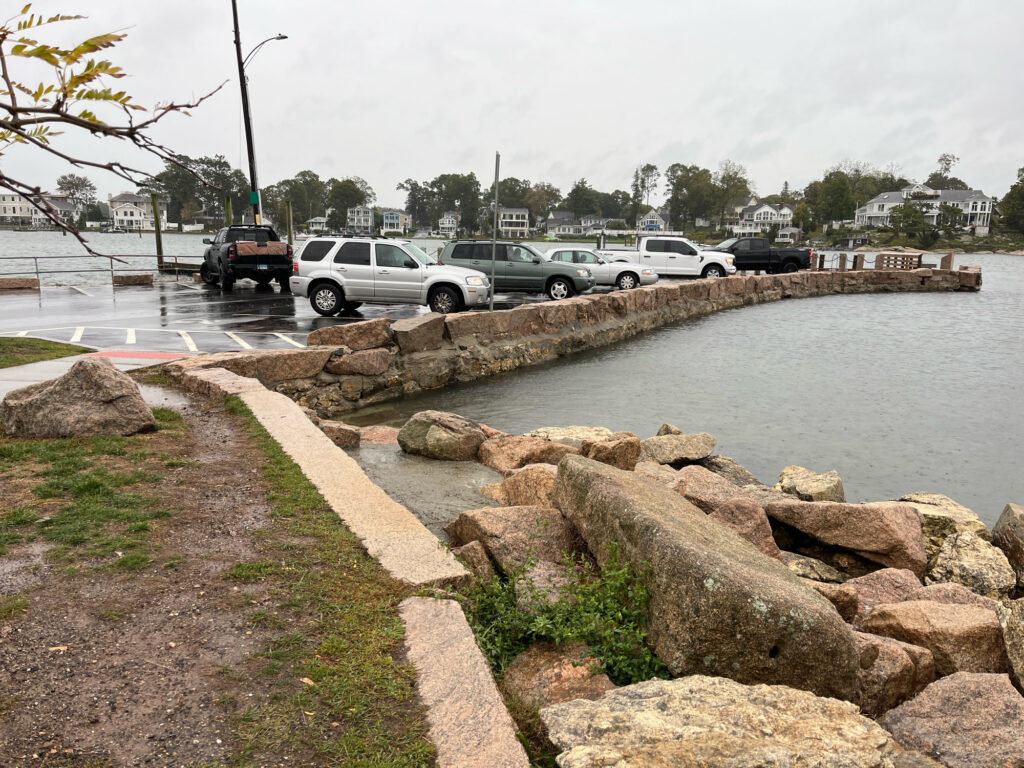 a body of water with cars parked along it (MyCoast AI)