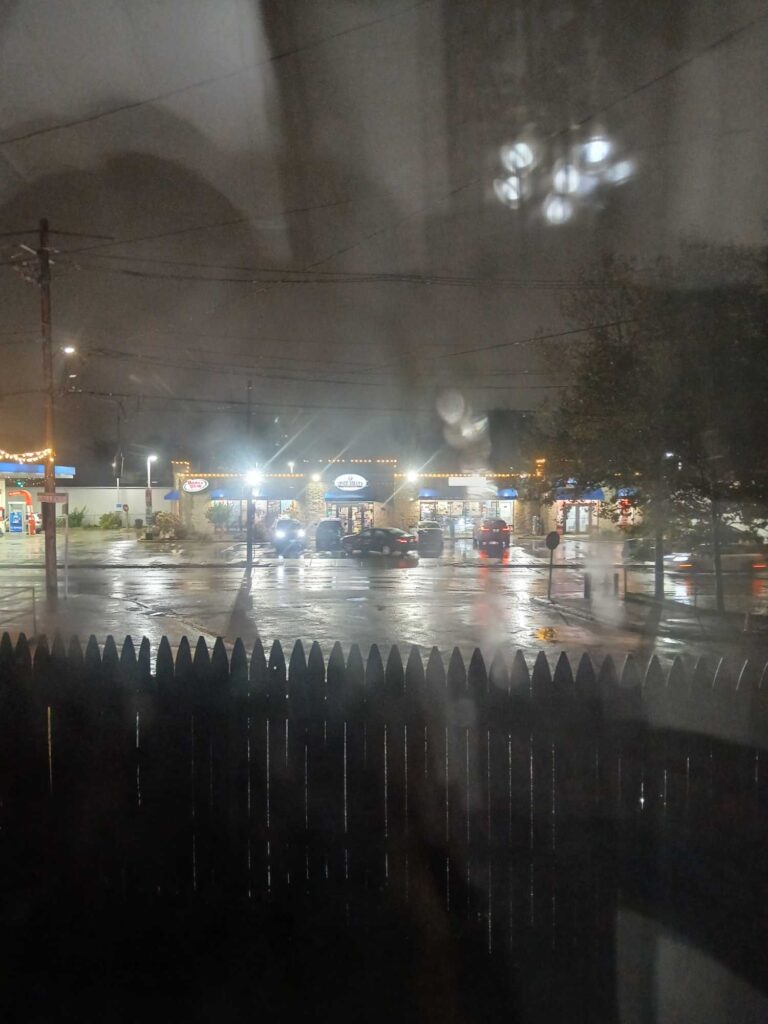 a rainy night with cars and buildings (MyCoast AI)