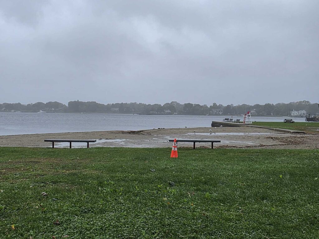 a bench sits by a body of water (MyCoast AI)