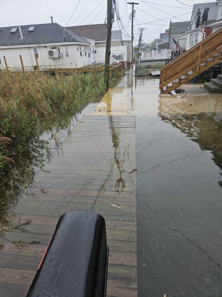 a flooded street with houses (MyCoast AI)