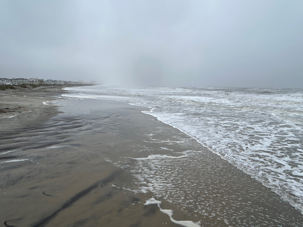 a beach with waves crashing on it (MyCoast AI)