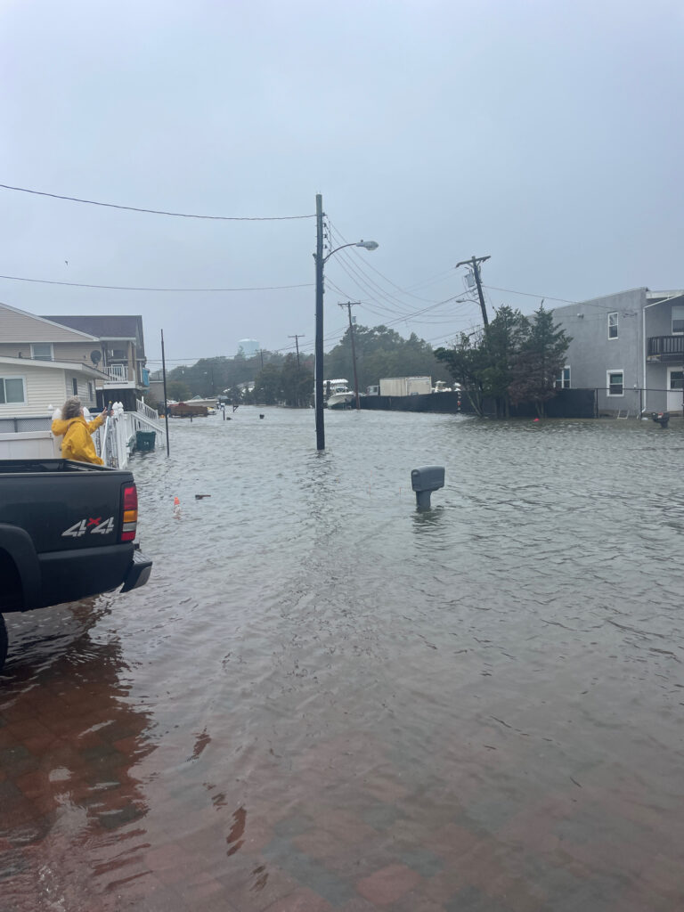 a flooded street with a car (MyCoast AI)