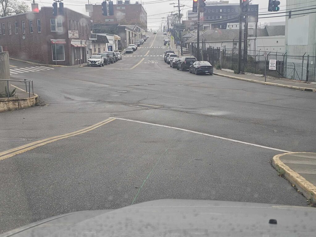 a street with cars on it (MyCoast AI)