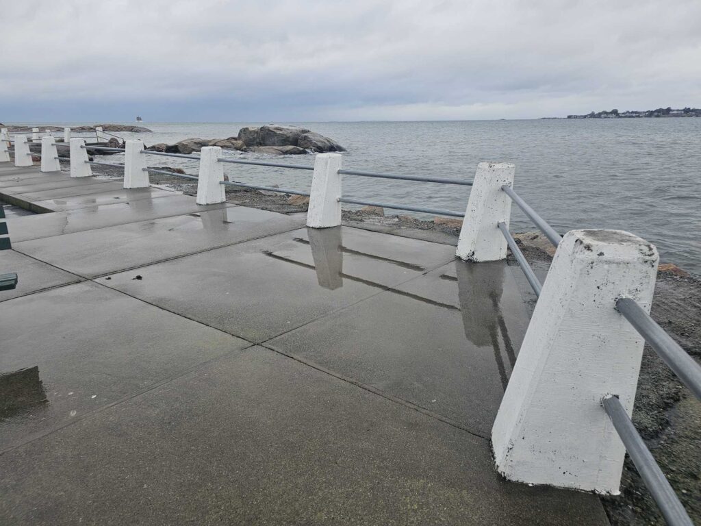 a concrete walkway over water (MyCoast AI)