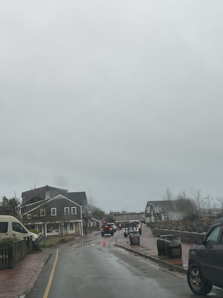 a road with cars on it and buildings on the side (MyCoast AI)