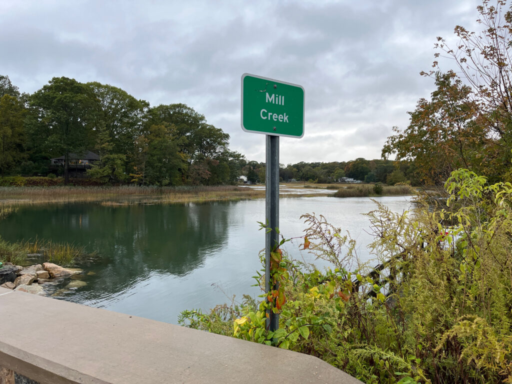 a sign next to a river (MyCoast AI)