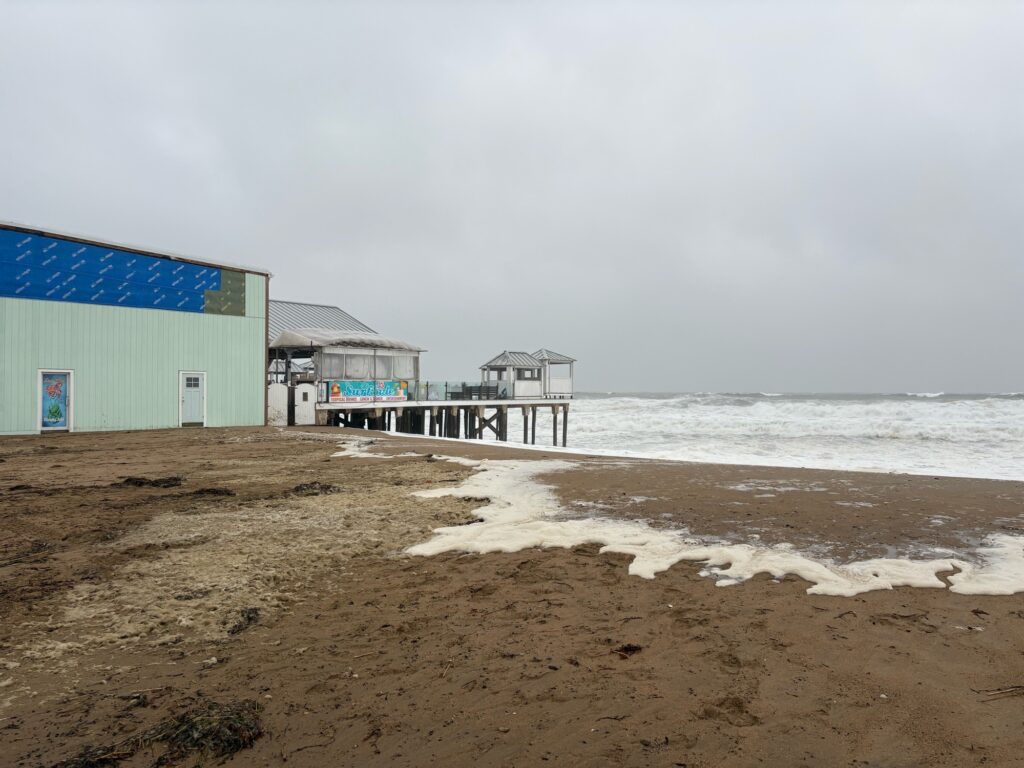 a beach with buildings along it (MyCoast AI)