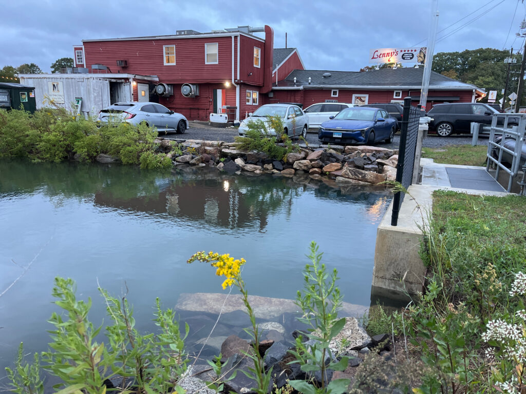 a pond with a building in the background (MyCoast AI)