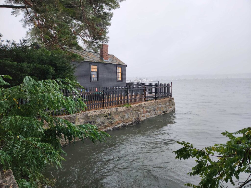 a house on a dock over a body of water (MyCoast AI)