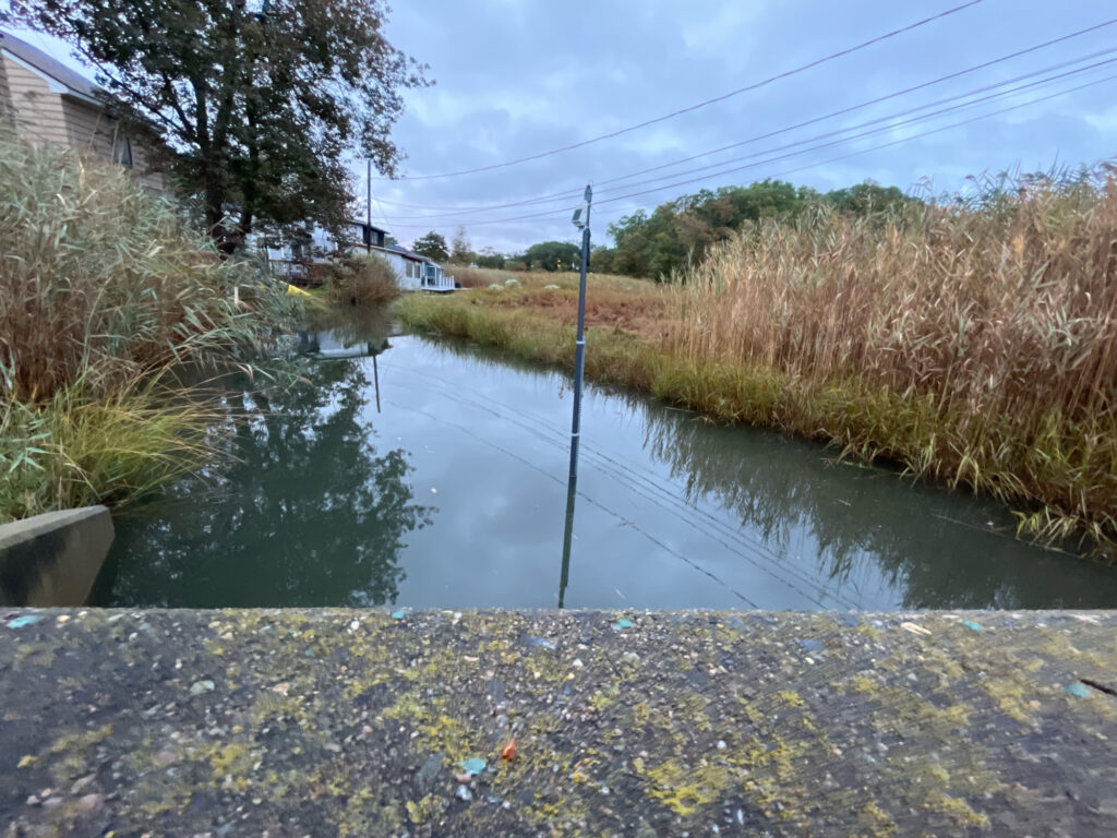 a river with a pole in it (MyCoast AI)