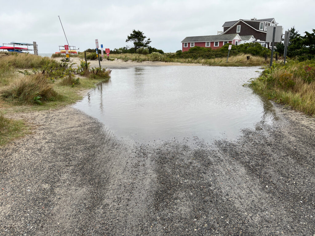 a flooded road with buildings on either side of it (MyCoast AI)